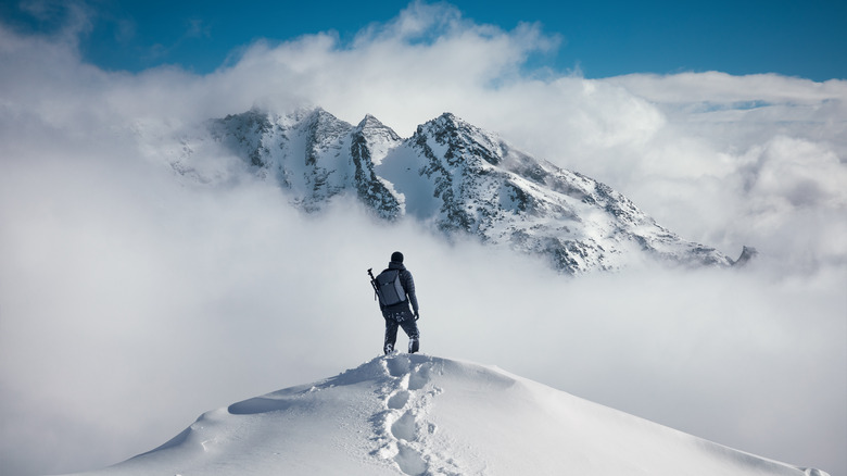 Mountain climber  atop a summit