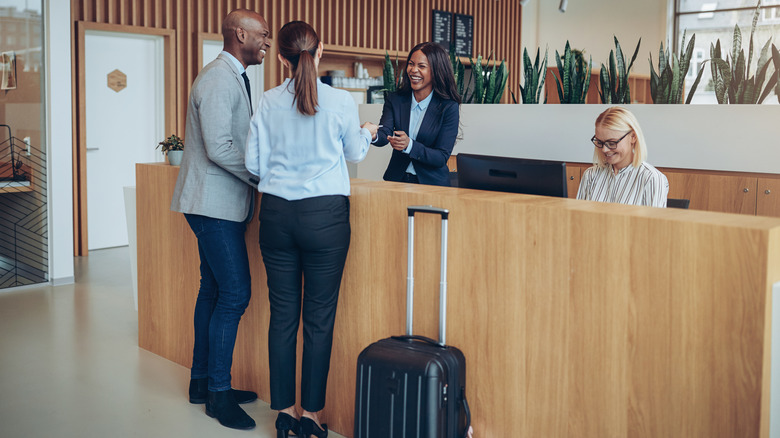 Couple checking in at hotel