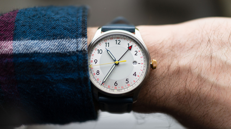 checking time on watch