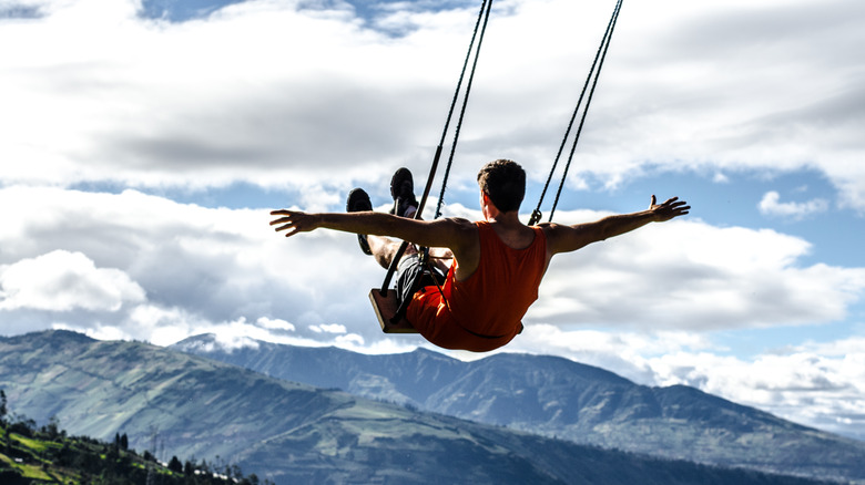 Man swinging in Ecuador