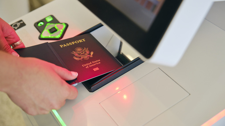 scanning passport at kiosk