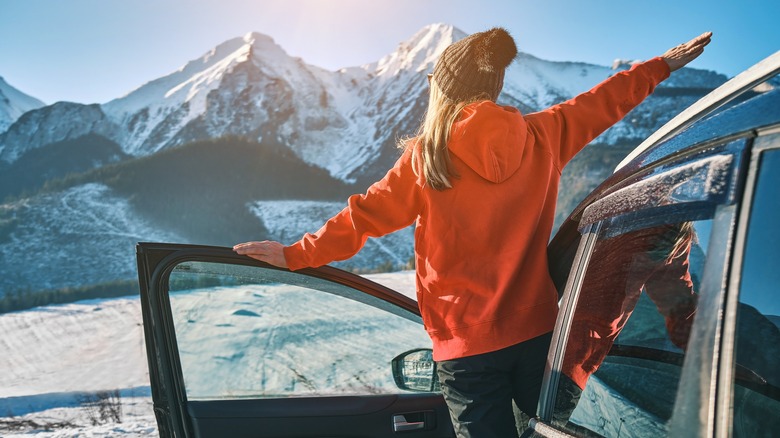 woman enjoying snowy mountain view