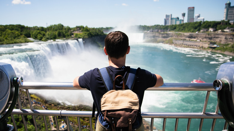 Man looks at Niagara Falls
