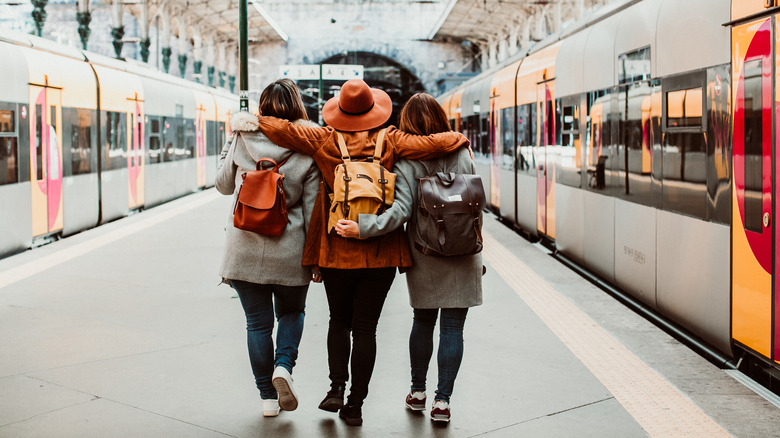 three girls on train platform