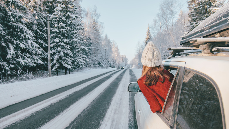 Girl driving snowy road