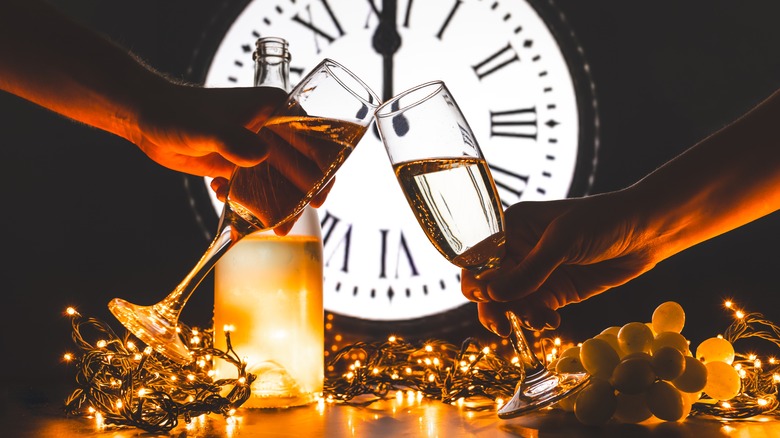 Toasting drinks with string lights