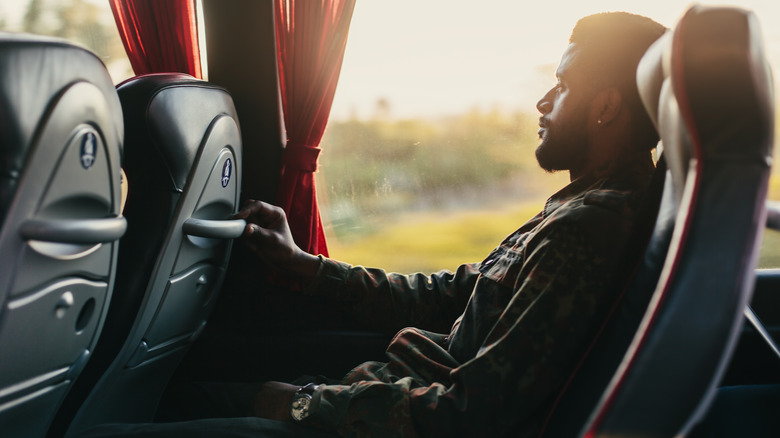 man traveling on bus