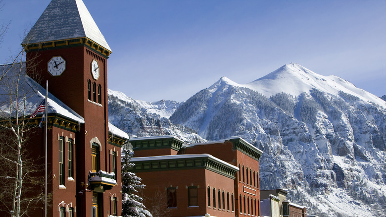 town hall and snowy mountains