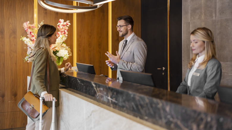 Traveler at hotel front desk