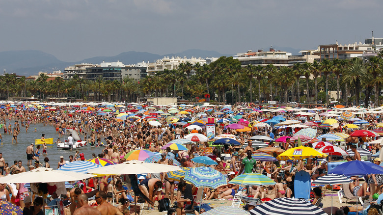 Crowded beach and umbrellas
