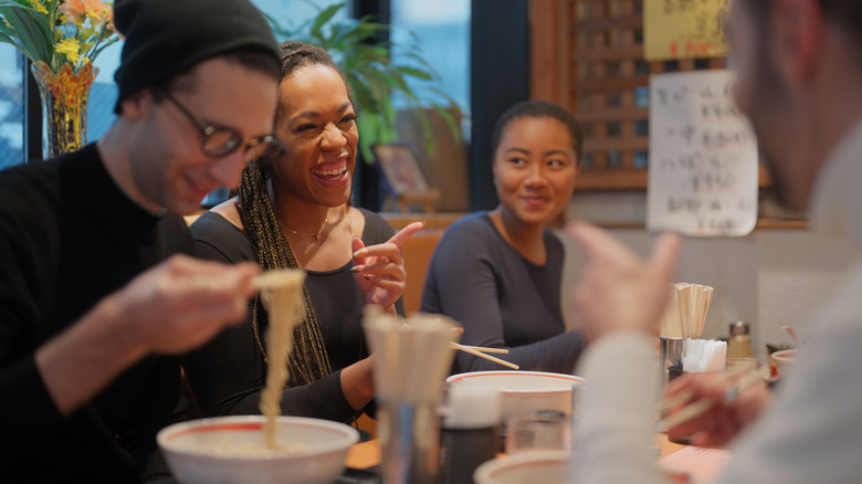 group of friends having chinese food
