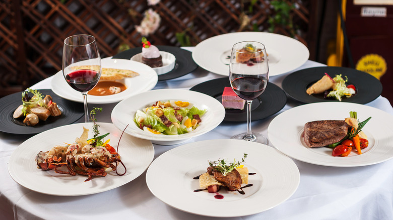 a selection of French dishes laid out on a table in a French restaurant