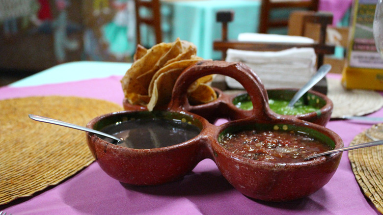 A trio of salsas at a Mexican restaurant.