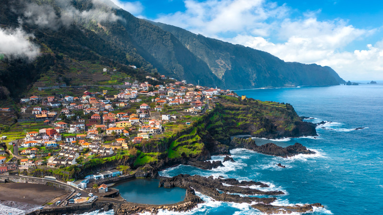 Aerial view of a cliffside village in the ocean