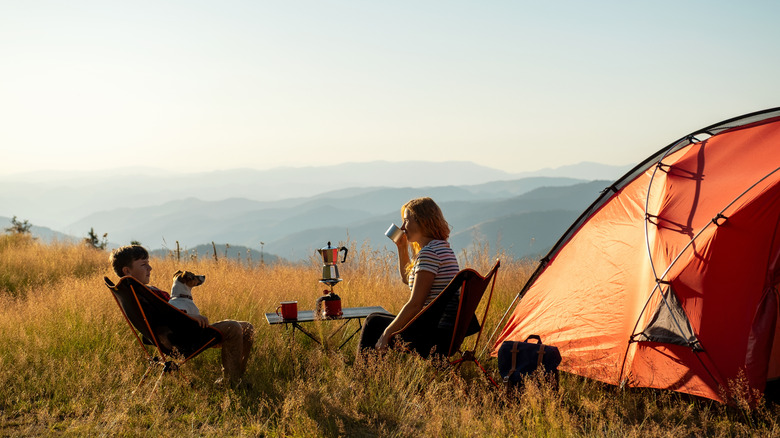 couple camping at sunset