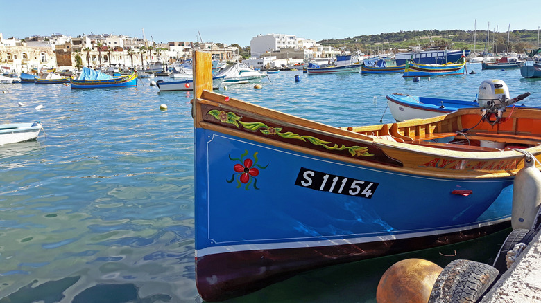 A blue wooden boat in the water