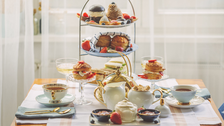 an elegant afternoon tea spread with a tiered tray
