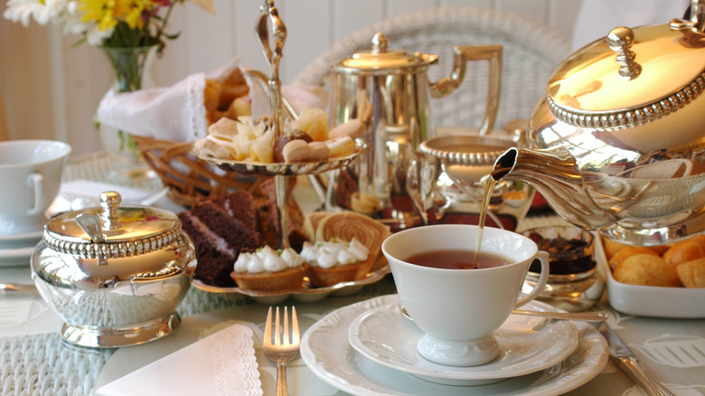 a formal table set with afternoon tea