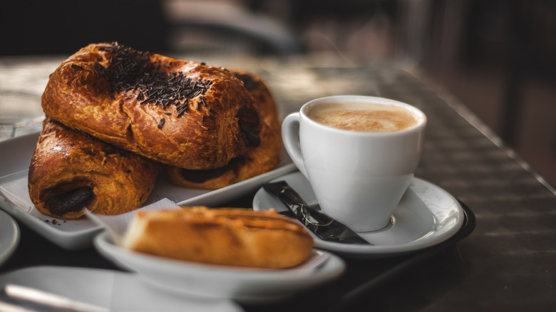 A small cup of coffee and pastries