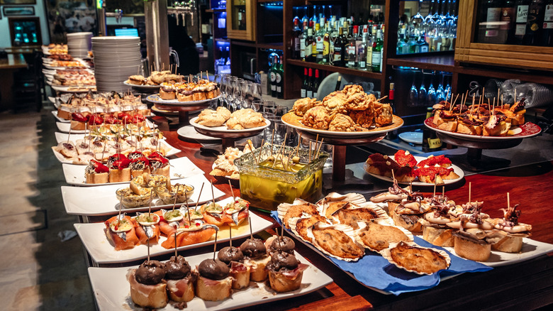Plates of tapas sitting on a bar in San Sebastian, Spain.