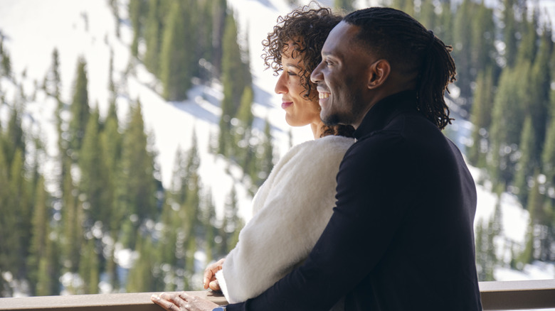 couple looking at winter mountains