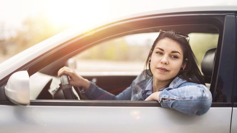 Woman driving and smiling
