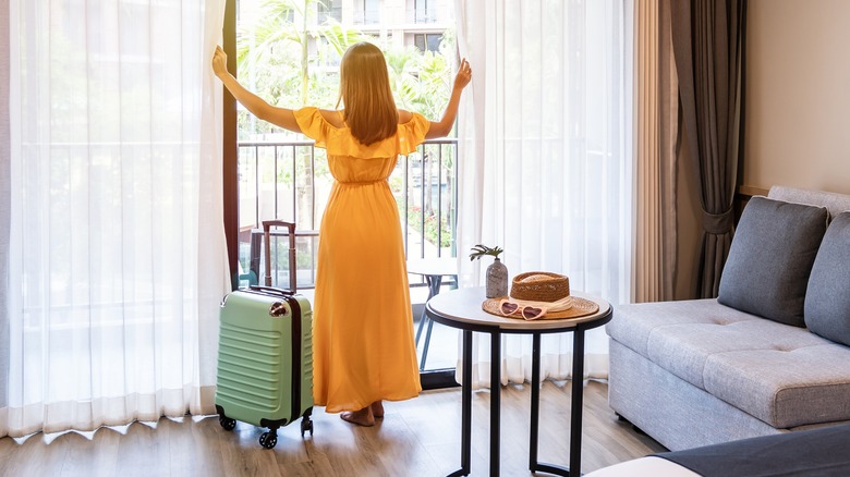 woman standing in hotel room