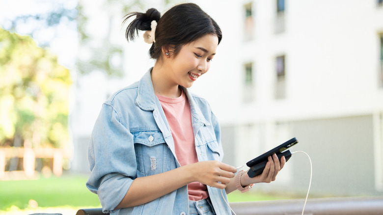woman with portable charger
