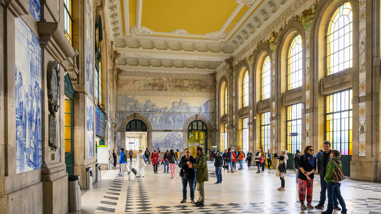 the tiled interior and Neoclassical designed windows of Sao Bento Station in Porto, Portugal