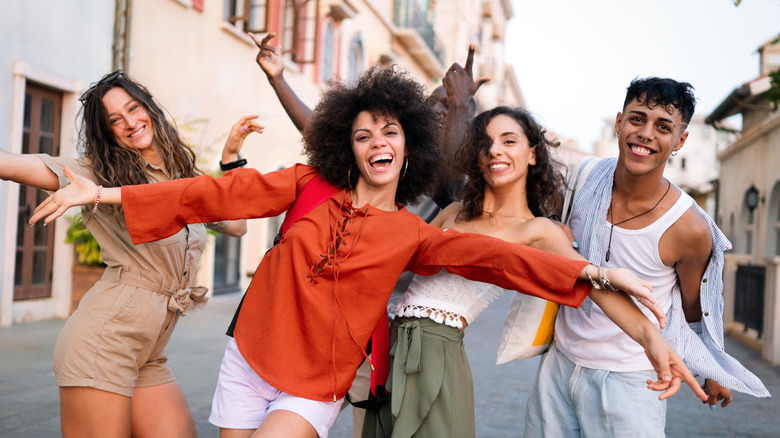A happy group of travelers posing for the camera.