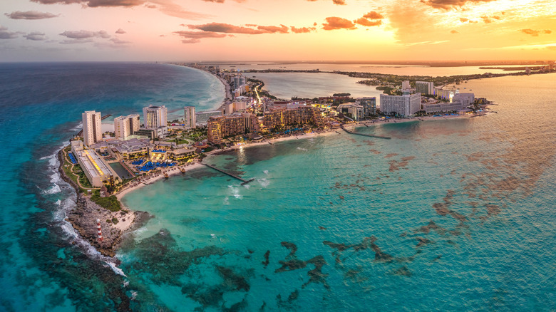 Resorts on strip of Cancun surrounded by turquoise water