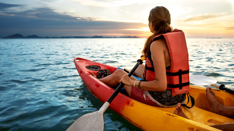 couple kayaking on the ocean