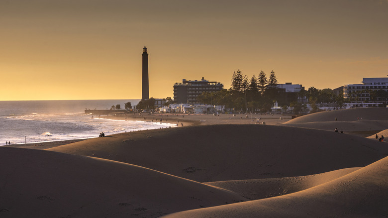View of Maspalomas lighthouse and the dunes of the beach at sunset