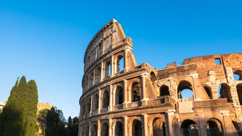Rome, Italy. Colosseum against the blue sky at sunset.