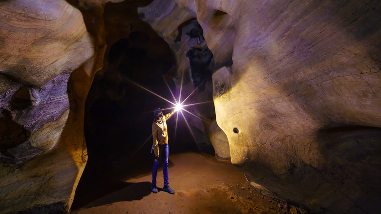 woman exploring a cave
