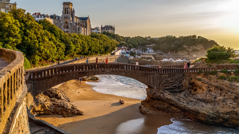 stone bridge over sandy beach in Biarritz France