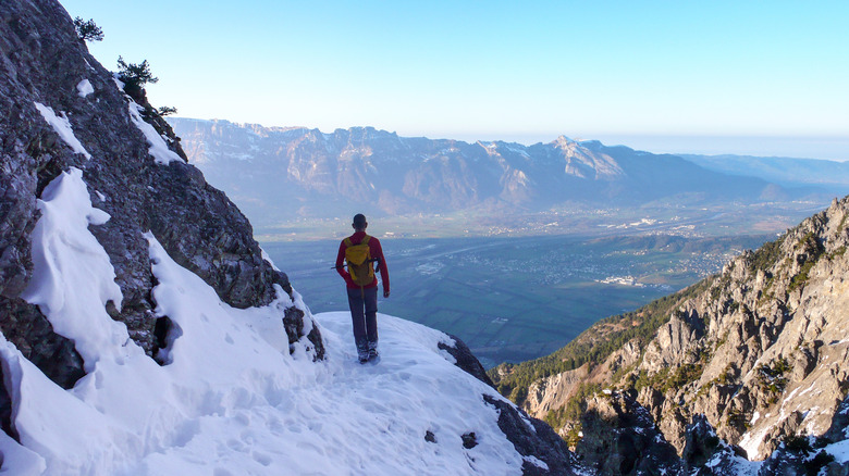 Hiker on a snowy mountain in Liechtenstein