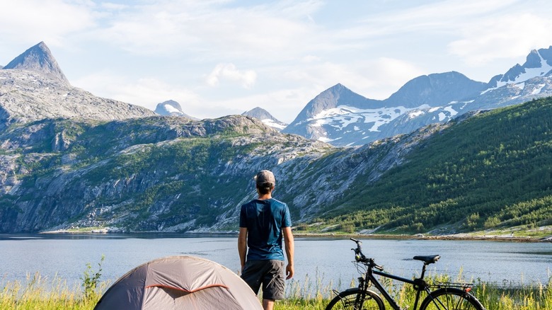 man camping near mountains