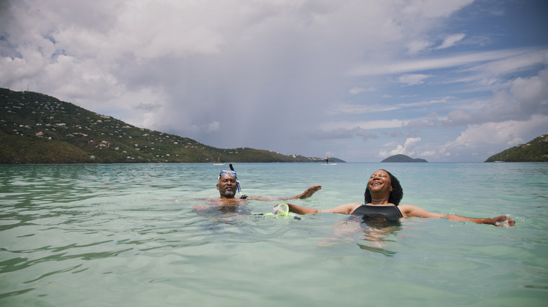 A couple snorkeling in the ocean
