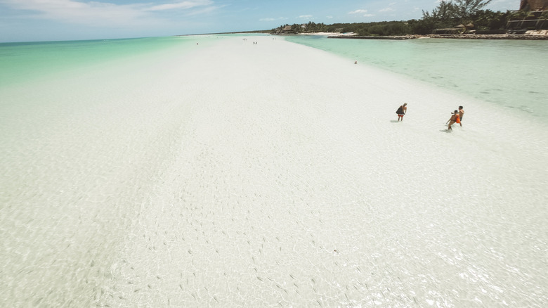 White-sand beach and shallow turquoise sea on Isla Holbox