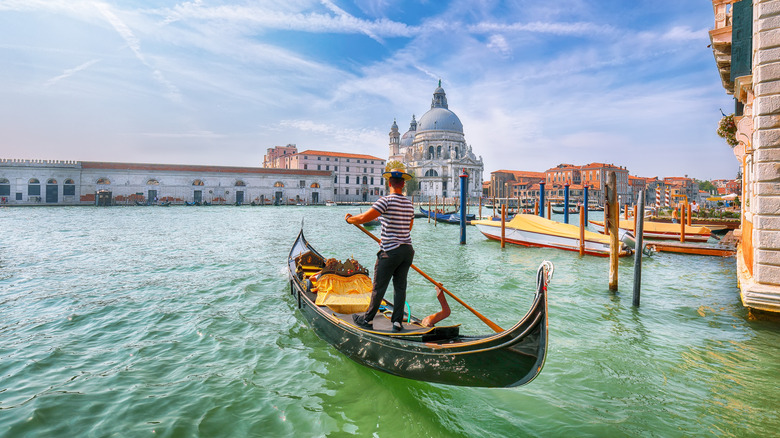 Gondolier going through Venice