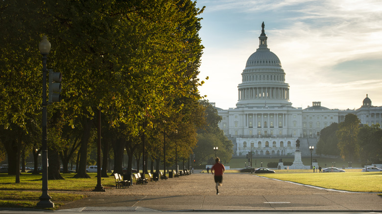 A person jogging along a path to the Capitol building.