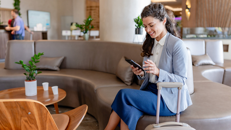 A woman relaxing in an airport lounge area