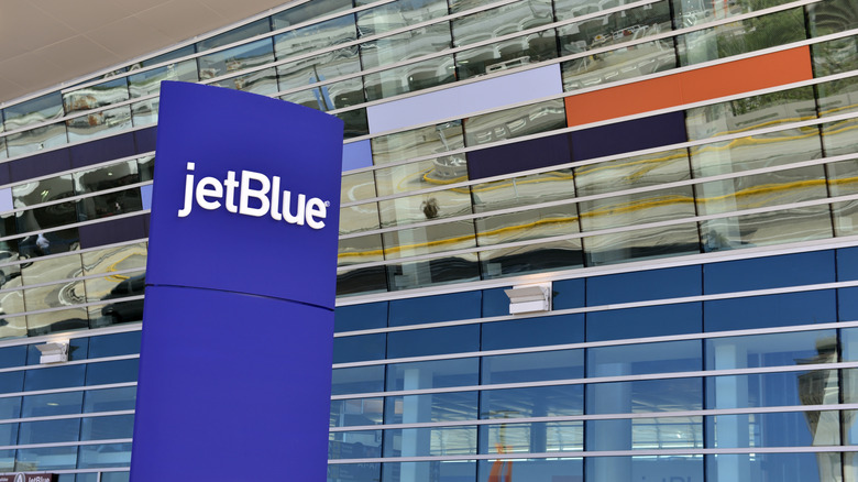 A JetBlue sign at an airport
