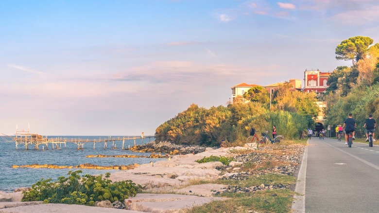 Pedestrian path with cyclists and walkers next to the sea