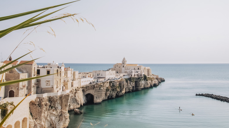Italian town with white houses by the sea