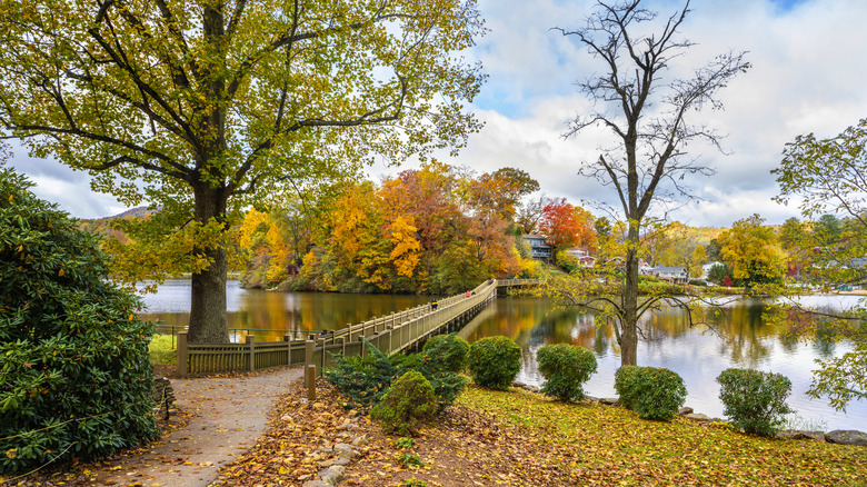 bridge over Lake Junaluska with fall foliage all around