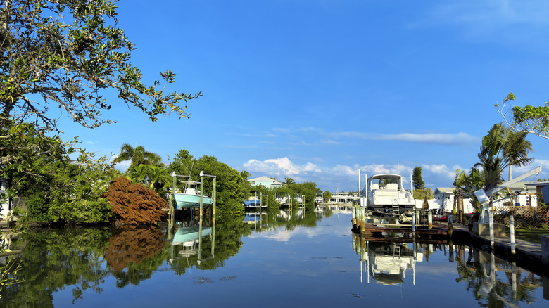 View of canal and boats over sunny sky in Anna Maria Island, Florida