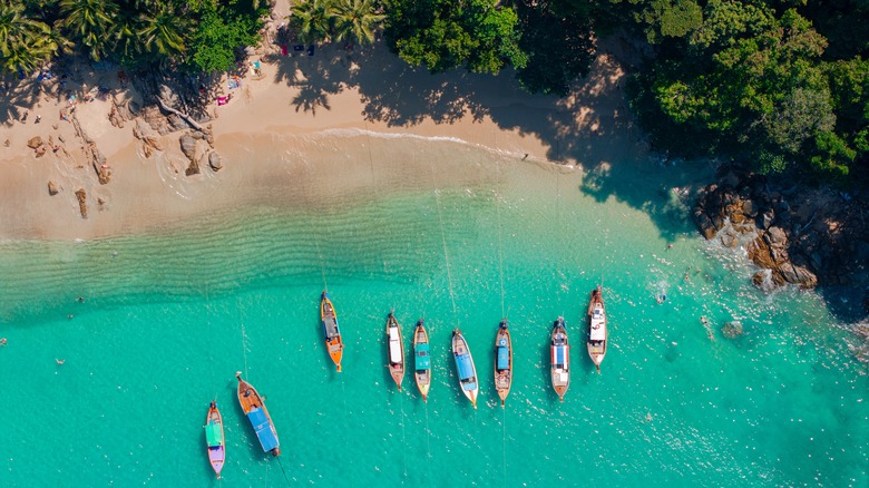 Drone shot of boats in turquoise tropical water