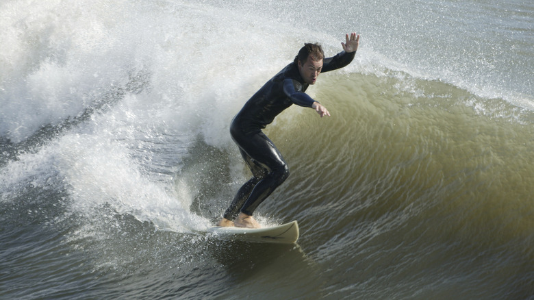 A man surfs off the coast of the Outer Banks